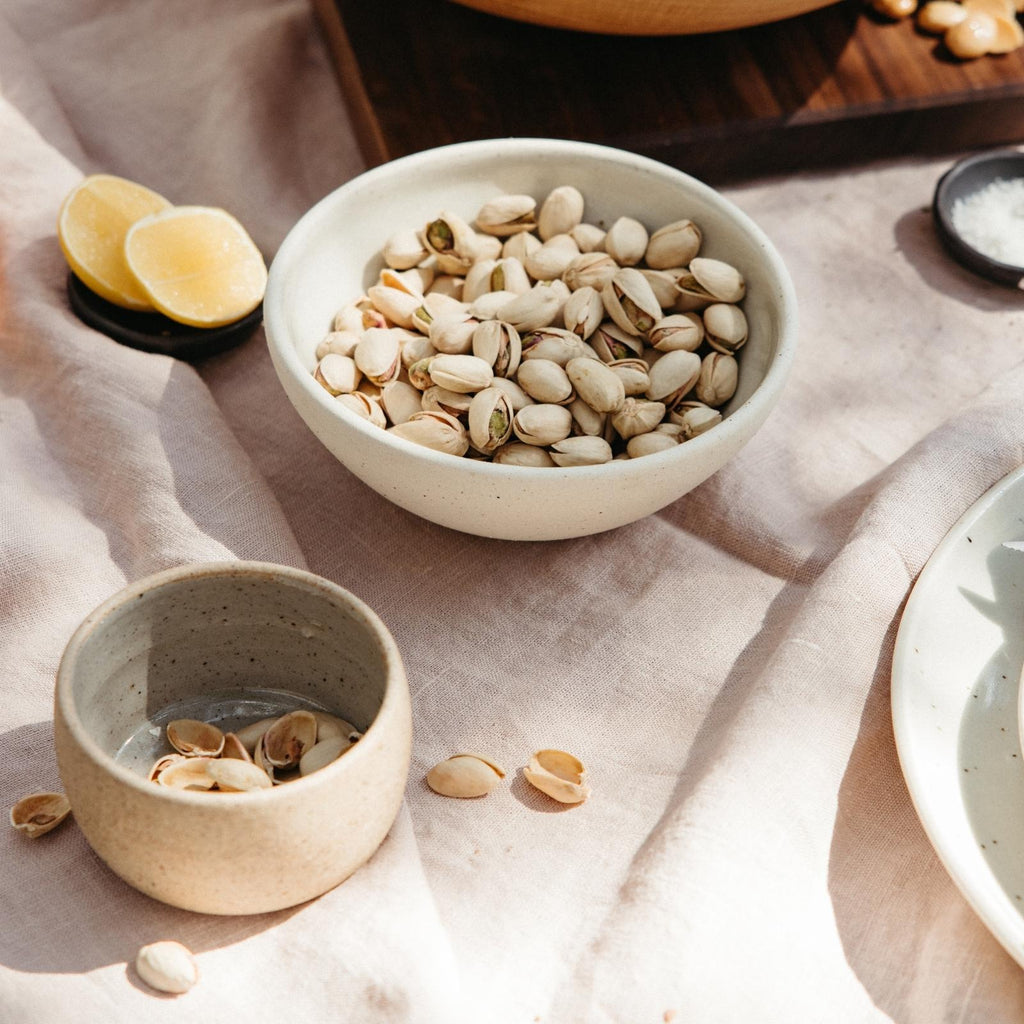 stoneware bowls with pistachios lemons