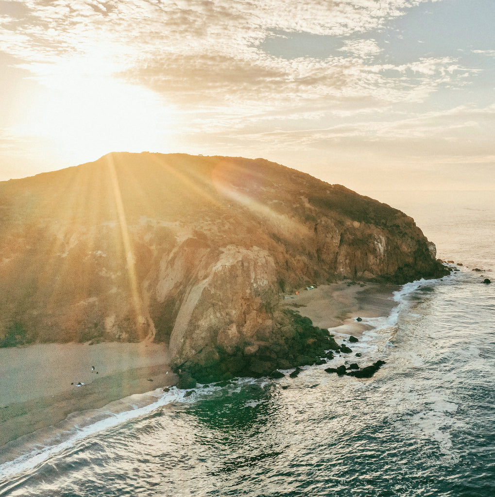 casa-zuma-waves-crashing-into-beach-sunrise