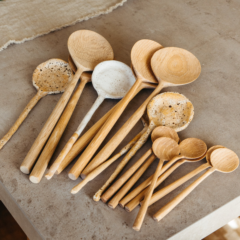 ceramic serving spoons on counter