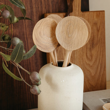 Wood Salad Servers in tapered vase with wooden serving boards